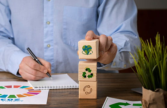 Man stacking recycling blocks