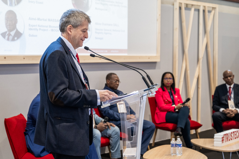 TRUSTECH conference room on Identification with Guy DE FELCOURT speaking in front of a panel of speakers and attendees