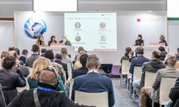 People attending a round table on digital identity at TRUSTECH featuring 5 speakers