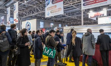 Visitors waiting at the TRUSTECH entrance before visiting the event