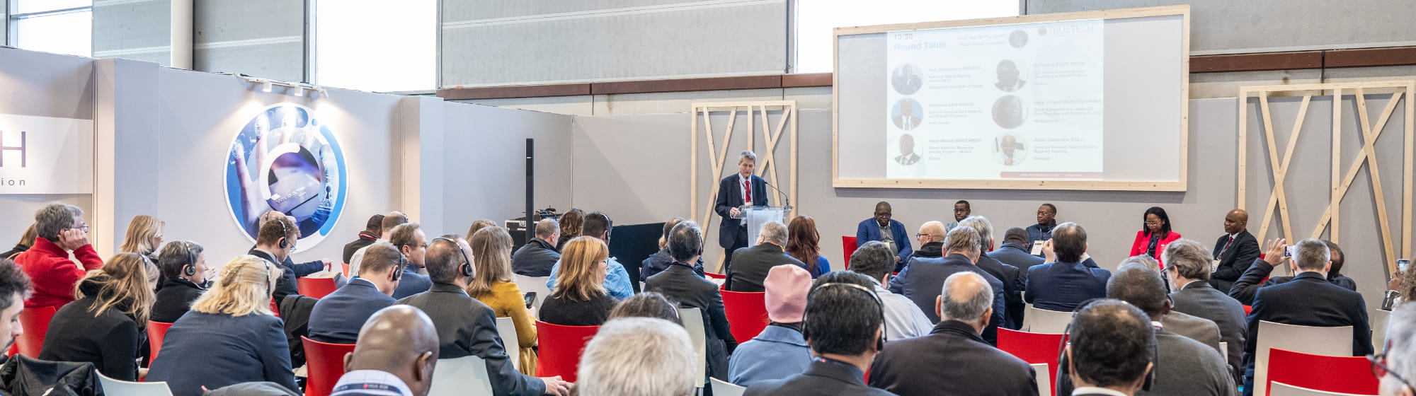 TRUSTECH conference room on Identification with Guy DE FELCOURT speaking in front of a panel of speakers and attendees