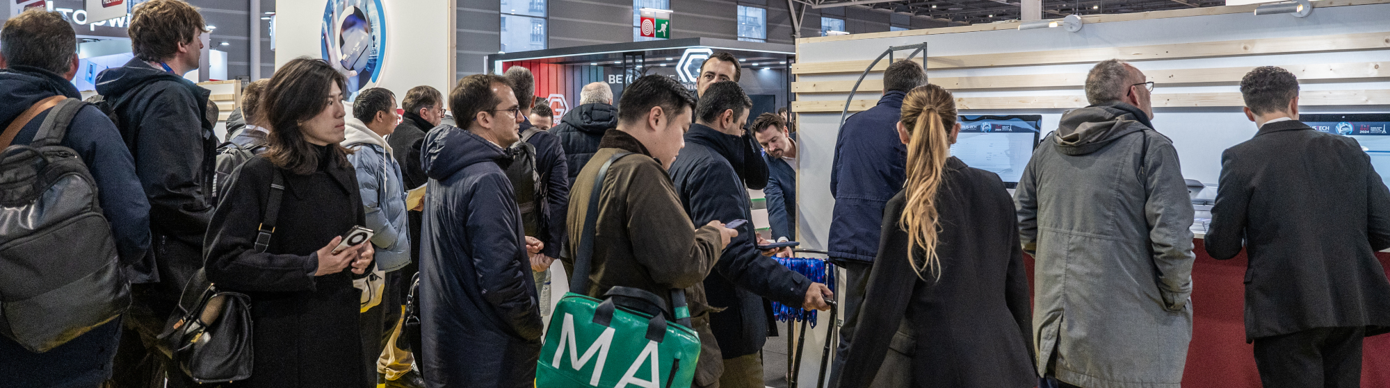 Visitors waiting at the TRUSTECH entrance before visiting the event