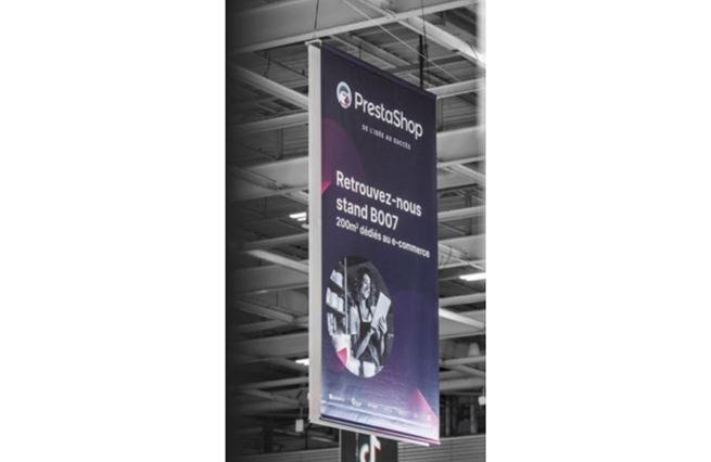 vertical banner prestashop with advertising and stand number in overhead signage during an event